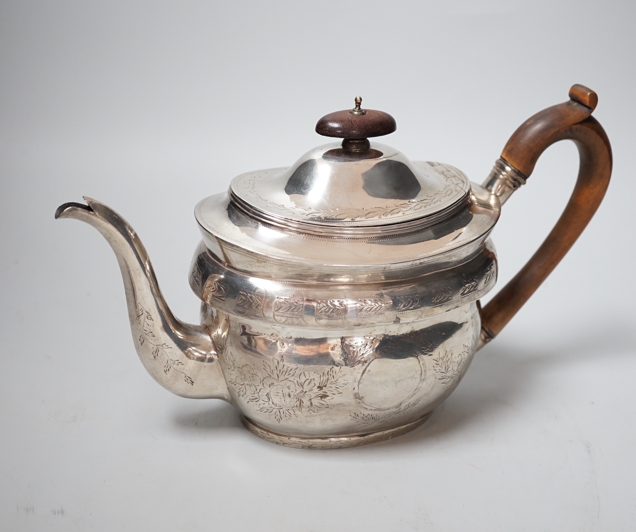 A George III engraved silver oval teapot, by Robert & Samuel Hennell, London, 1803, (repairs), gross weight 12.7oz.